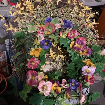 Assortment of faux flower wreaths with storage case