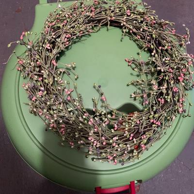 Assortment of faux flower wreaths with storage case