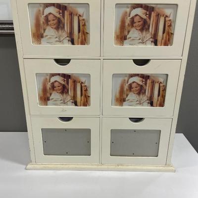 Wooden storage cabinet for pictures