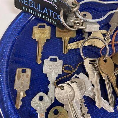 Keys, key chains and blue plate