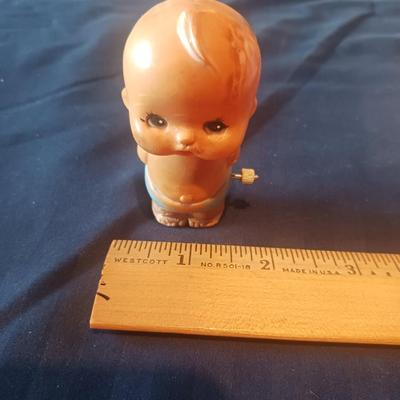 VINTAGE KEWPIE DOLL POWDER DISPENSER AND WIND-UP BABY