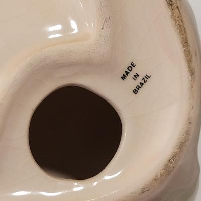 Porcelain or Chalkware, painted / glazed dog from Brazil