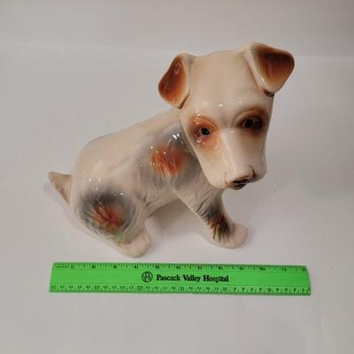 Porcelain or Chalkware, painted / glazed dog from Brazil