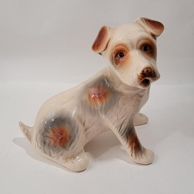Porcelain or Chalkware, painted / glazed dog from Brazil