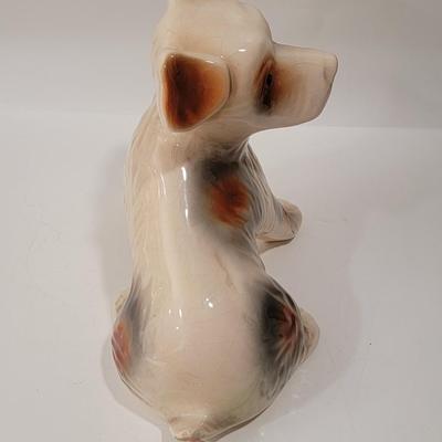 Porcelain or Chalkware, painted / glazed dog from Brazil
