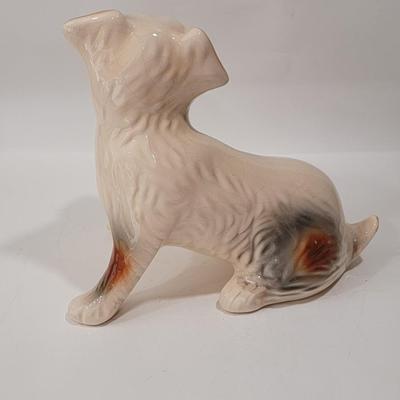 Porcelain or Chalkware, painted / glazed dog from Brazil