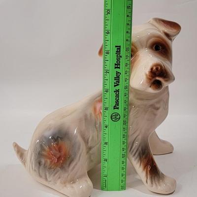 Porcelain or Chalkware, painted / glazed dog from Brazil