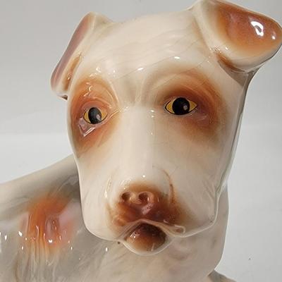 Porcelain or Chalkware, painted / glazed dog from Brazil