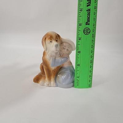 Small figurine girl and dog.