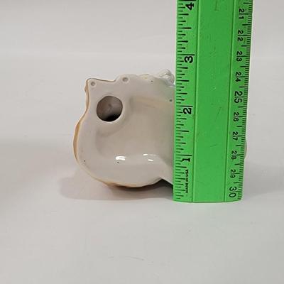 Small figurine girl and dog.
