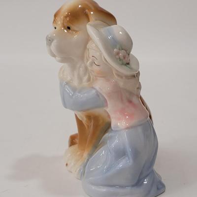 Small figurine girl and dog.