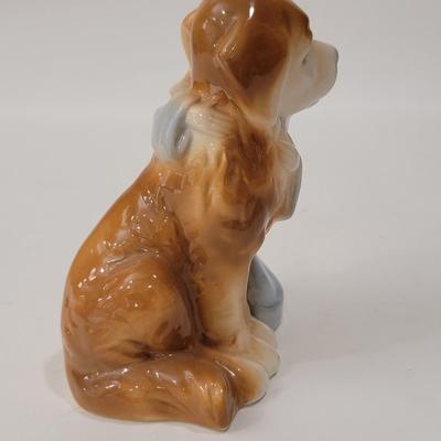 Small figurine girl and dog.