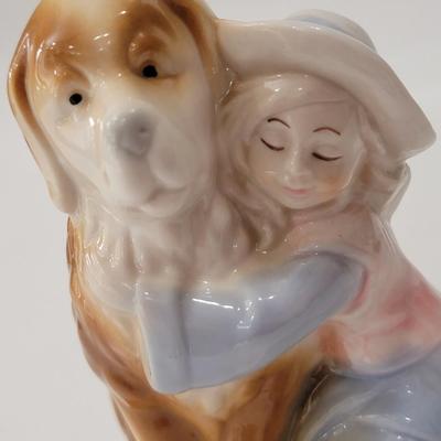 Small figurine girl and dog.