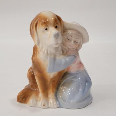 Small figurine girl and dog.