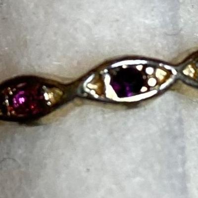 Thin goldtone ring with multicolored stones. Size 7