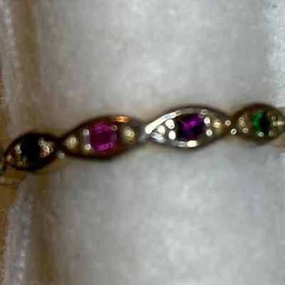 Thin goldtone ring with multicolored stones. Size 7
