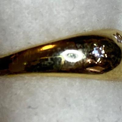 Goldtone dome ring with seven tiny CZ’s. Size 5.75