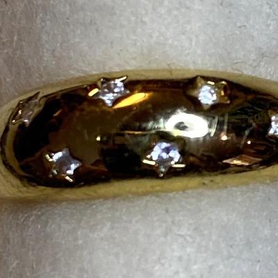 Goldtone dome ring with seven tiny CZ’s. Size 5.75