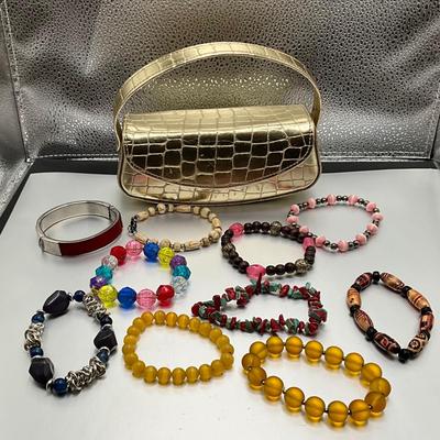 Group of bracelets and gold bag.