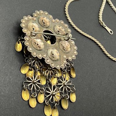 Vintage Pendent, clip earrings, hoop earrings are marked Lewis Segal