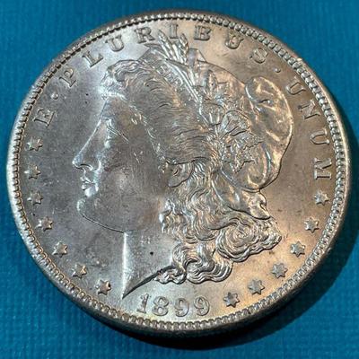 1899-O BU CONDITION MORGAN SILVER DOLLAR AS PICTURED.