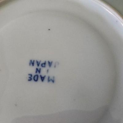 Blue and white flow blue cup and saucer with stand