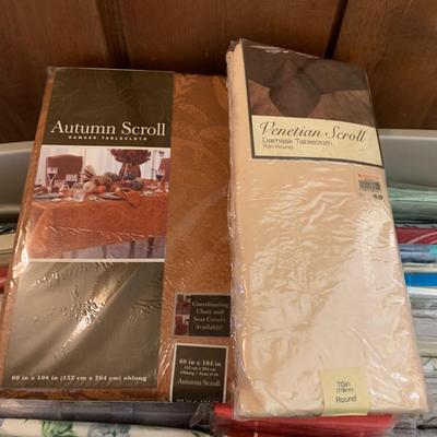 LOT 60: Assorted New in Package Tablecloths and More