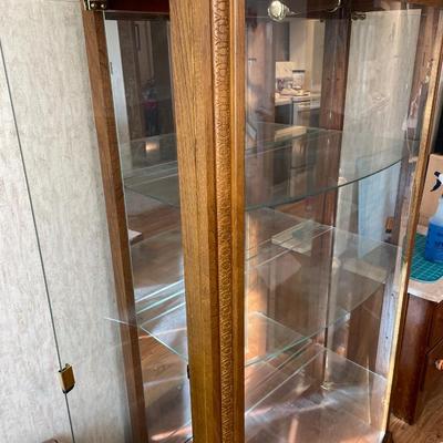 Curved front glass curio cabinet