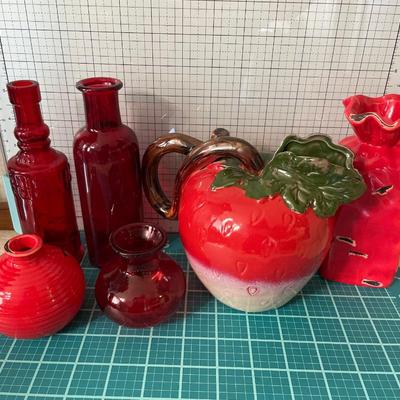 Red glass items including strawberry pitcher