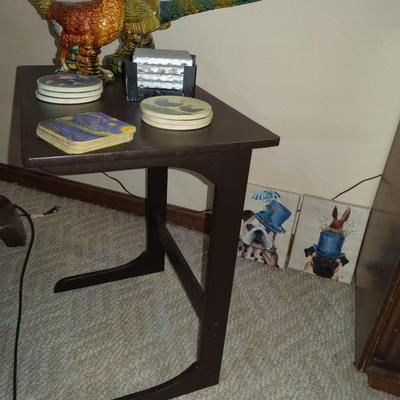 Wooden slide under sofa table