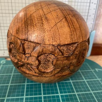 Carved camels, eagle and sphere wood decor