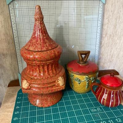 3 reddish color ceramic with lids