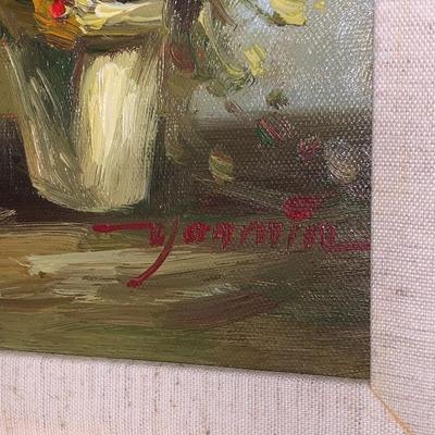Gold framed oil painting with accent light