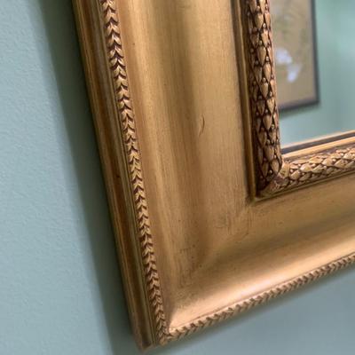 Gold framed wall mirror