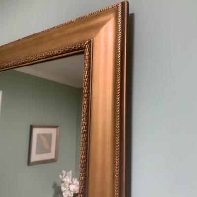 Gold framed wall mirror
