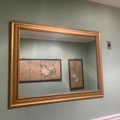 Gold framed wall mirror
