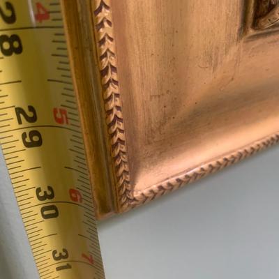 Gold framed wall mirror