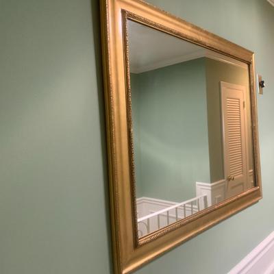 Gold framed wall mirror