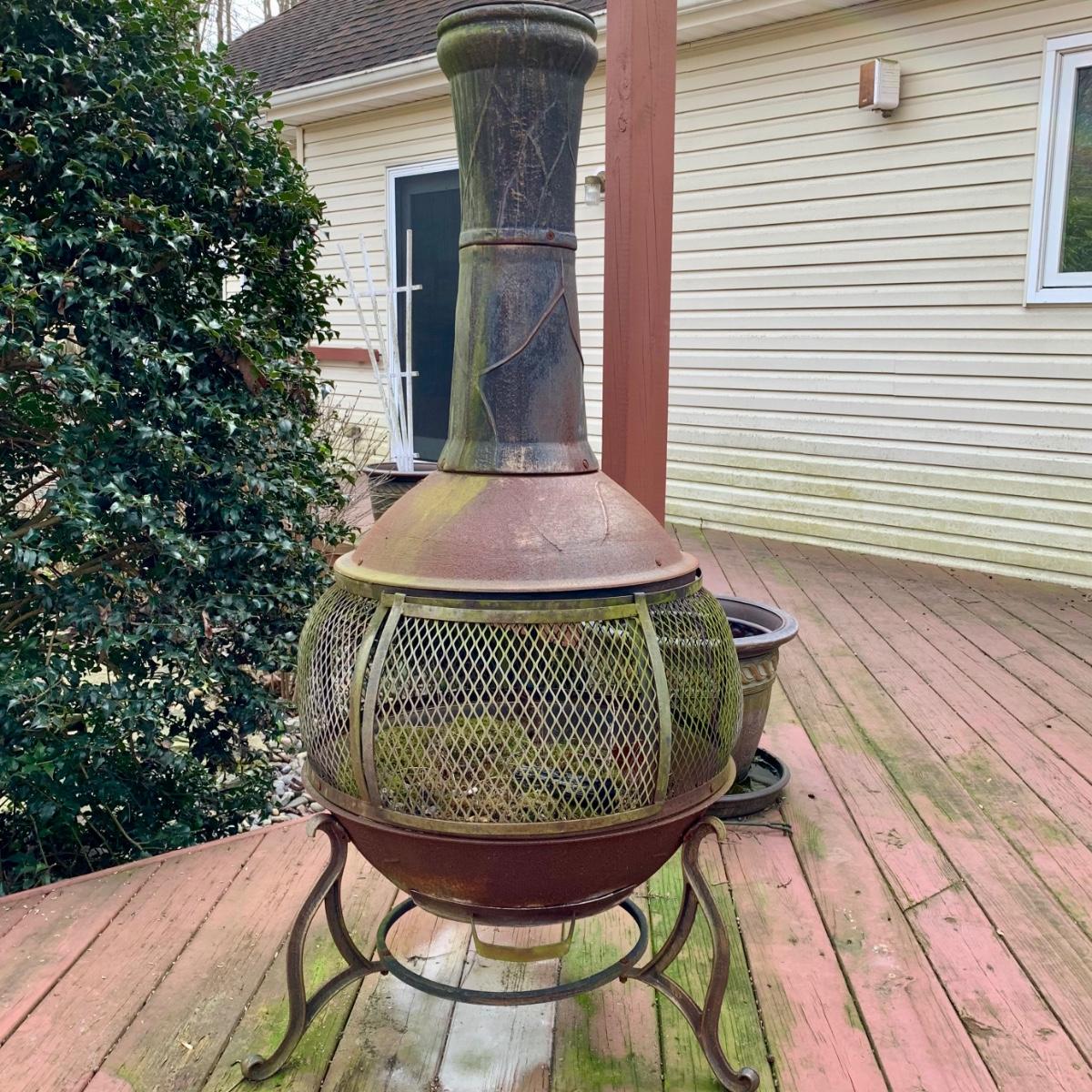 LOT 67 O: Cast Iron Pot Belly Chiminea | EstateSales.org