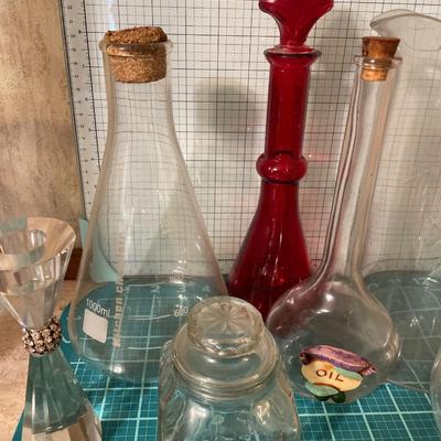 Clear glass items & 1 red glass bottle