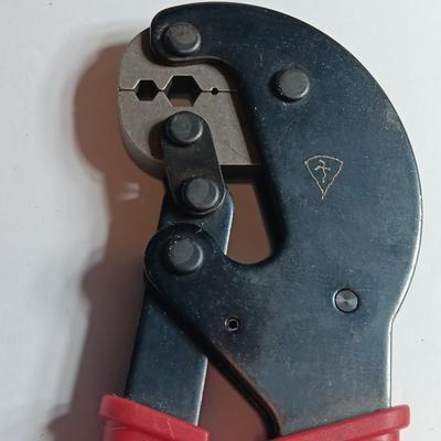 Cable Pliers - Cutters and a red Pro series 25-foot tape measure
