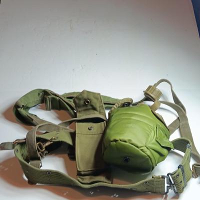 Military issued canteen with suspenders and ammunition bag