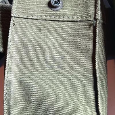 Military issued canteen with suspenders and ammunition bag