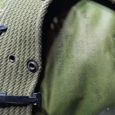 Military issued canteen with suspenders and ammunition bag