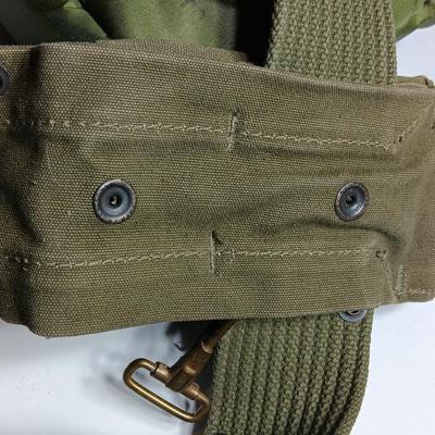 Military issued canteen with suspenders and ammunition bag