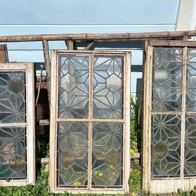 Antique leaded, stained glass windows, one needs repair.