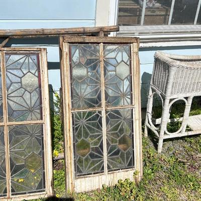 Antique leaded, stained glass windows, one needs repair.