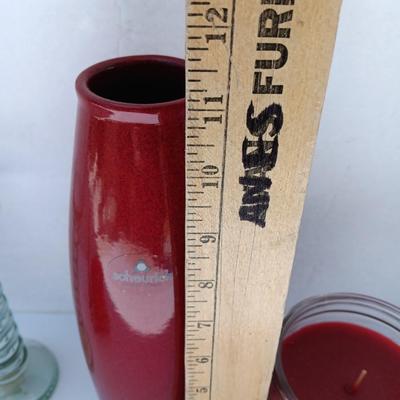 Red Scheurich Vase with Poinsettia candle holder clear vase and an unburned scented candle