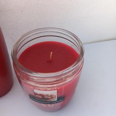 Red Scheurich Vase with Poinsettia candle holder clear vase and an unburned scented candle