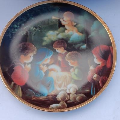 God Bless our home wall hanging with Precious Moments Christmas plate and small stained glass.